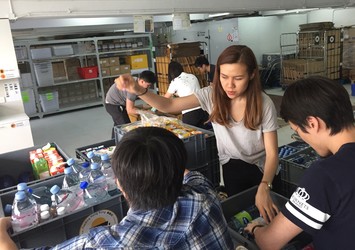 Students pack water at Feeding HK