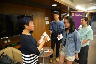 Xu Xi signs a copy of her book