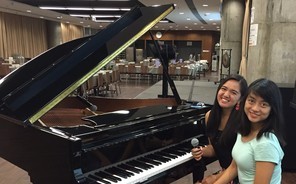 Students Eloisa Damulo and Jessica Chu Perform at Communal Dinner