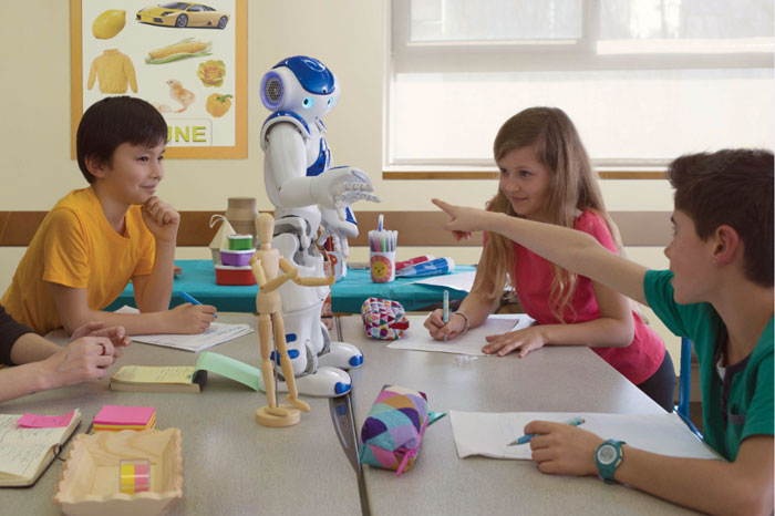 With the help of NAO, children are trained to recognize commonly used gestures, including certain markers and iconic gestures. <em>(Photo: Aldebaran)</em>