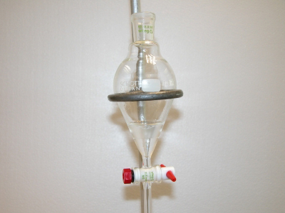 image: Using the separatory funnel to separate aspirin and caffeine