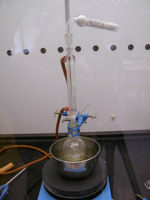 image: Heating the reaction mixture under reflux with an hot oil bath