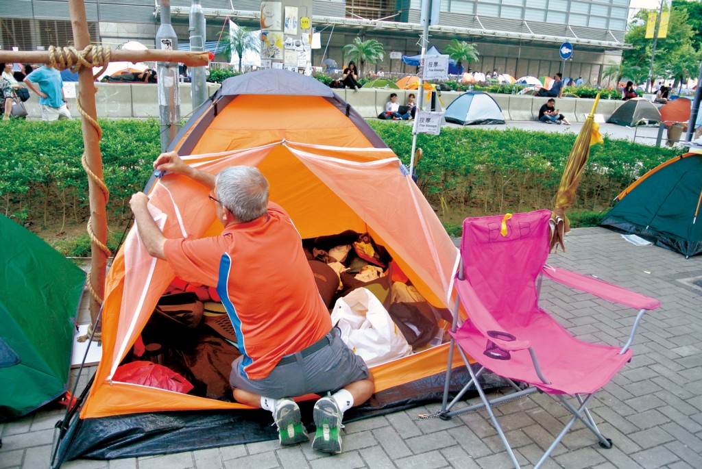 Kraft sets up a tent on the pavement outside the CGO.