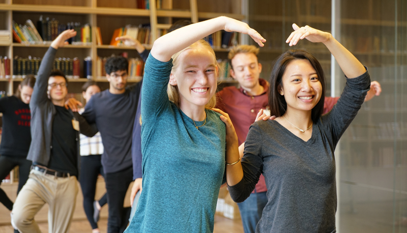 Friendship grows when students pair up at a yoga session at Tsz Shan Monastery.