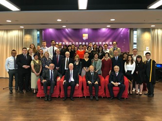 The attendees of the ceremony gather for a group picture