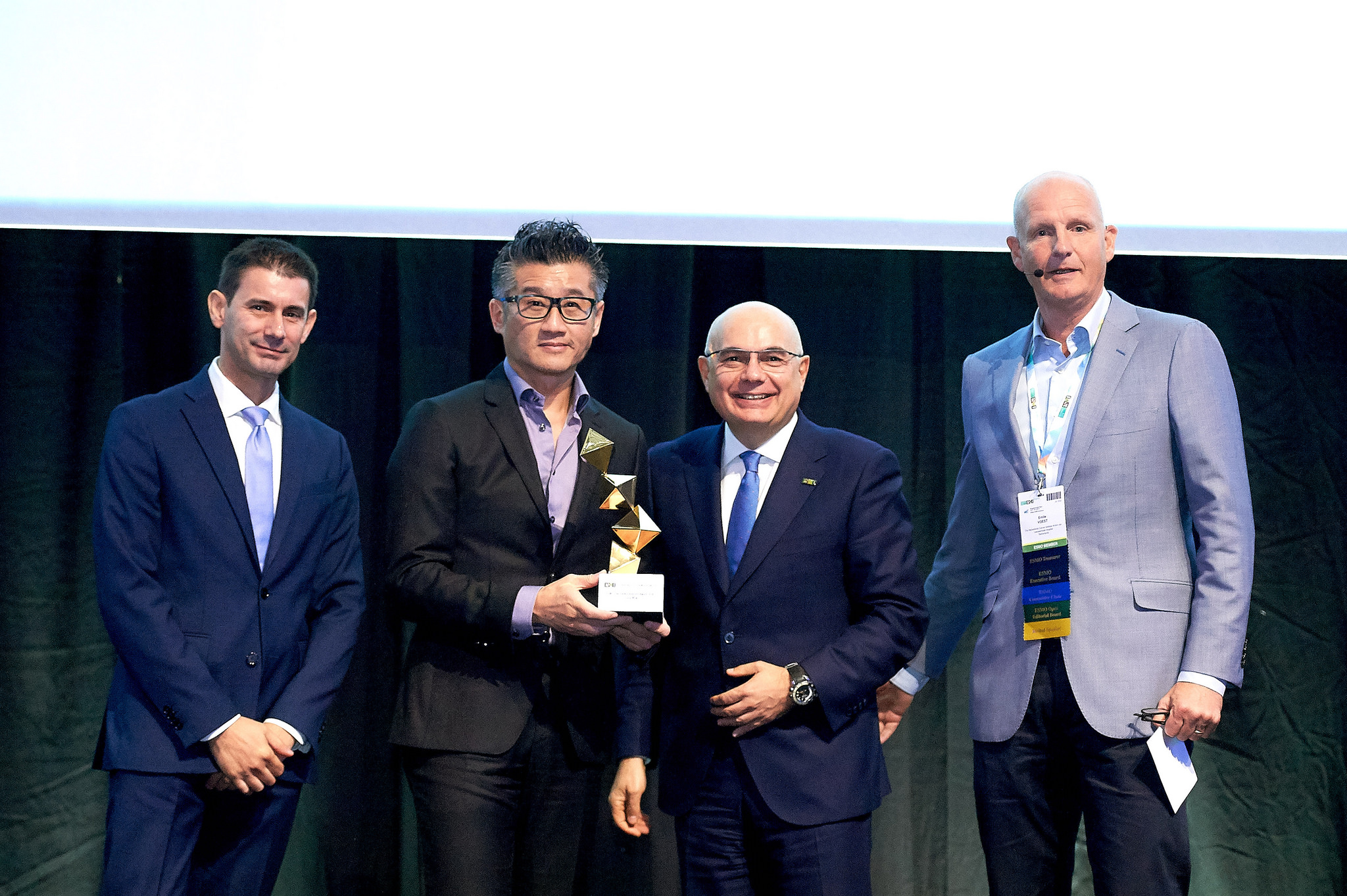 Professor Tony MOK (2nd from left), Li Shu Fan Medical Foundation Professor of Clinical Oncology and Chairman of the Department of Clinical Oncology of the Faculty of Medicine at CUHK, is bestowed with the European Society for Medical Oncology (ESMO) Lifetime Achievement Award for his practice changing contribution to lung cancer. Professor Mok is the first Chinese to receive this award. (Photo courtesy of the European Society for Medical Oncology)