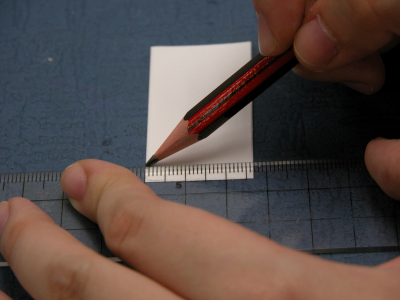 image: Marking the starting points on the TLC plate with a pencil