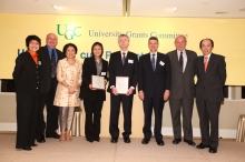 Mrs. Cha and members of the award's selection panel take a photo with the award recipients.