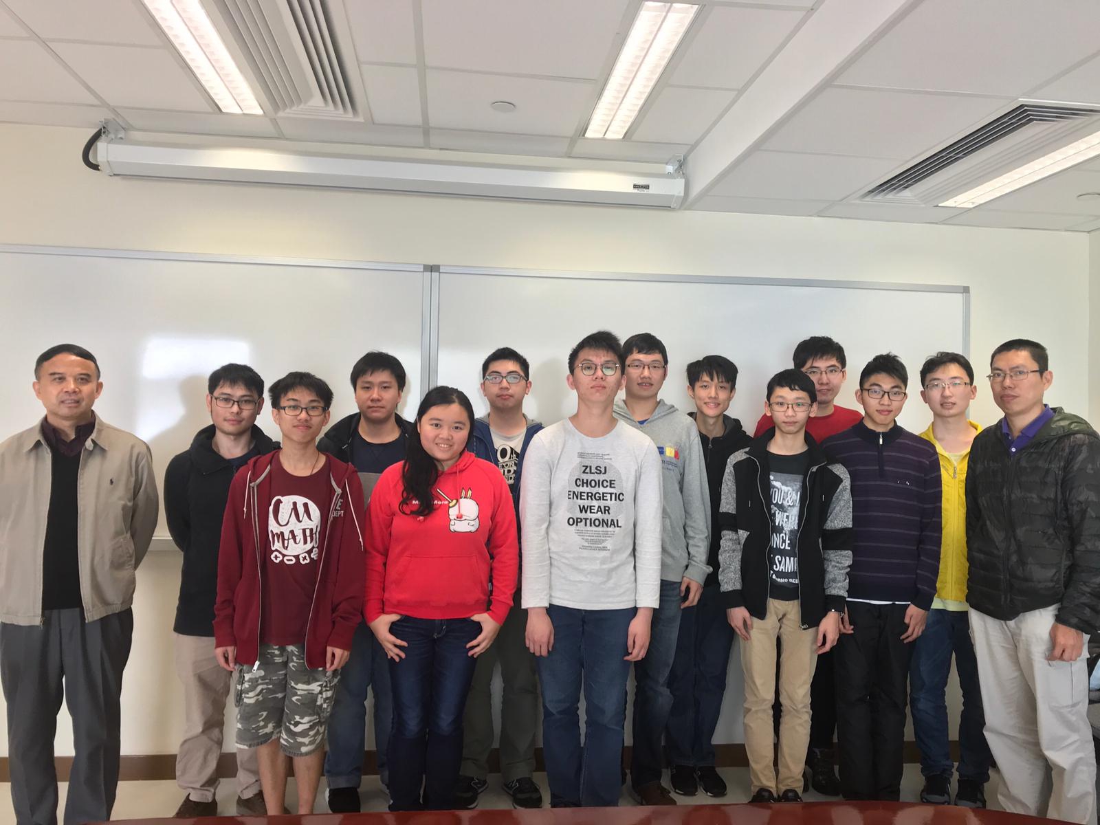 Professor Jun Zou, Chairman of the Department of Mathematics, CUHK (1st left), Dr. Chi-him Lau, Lecturer (1st right), and the mathematics students who participated in the Competition.