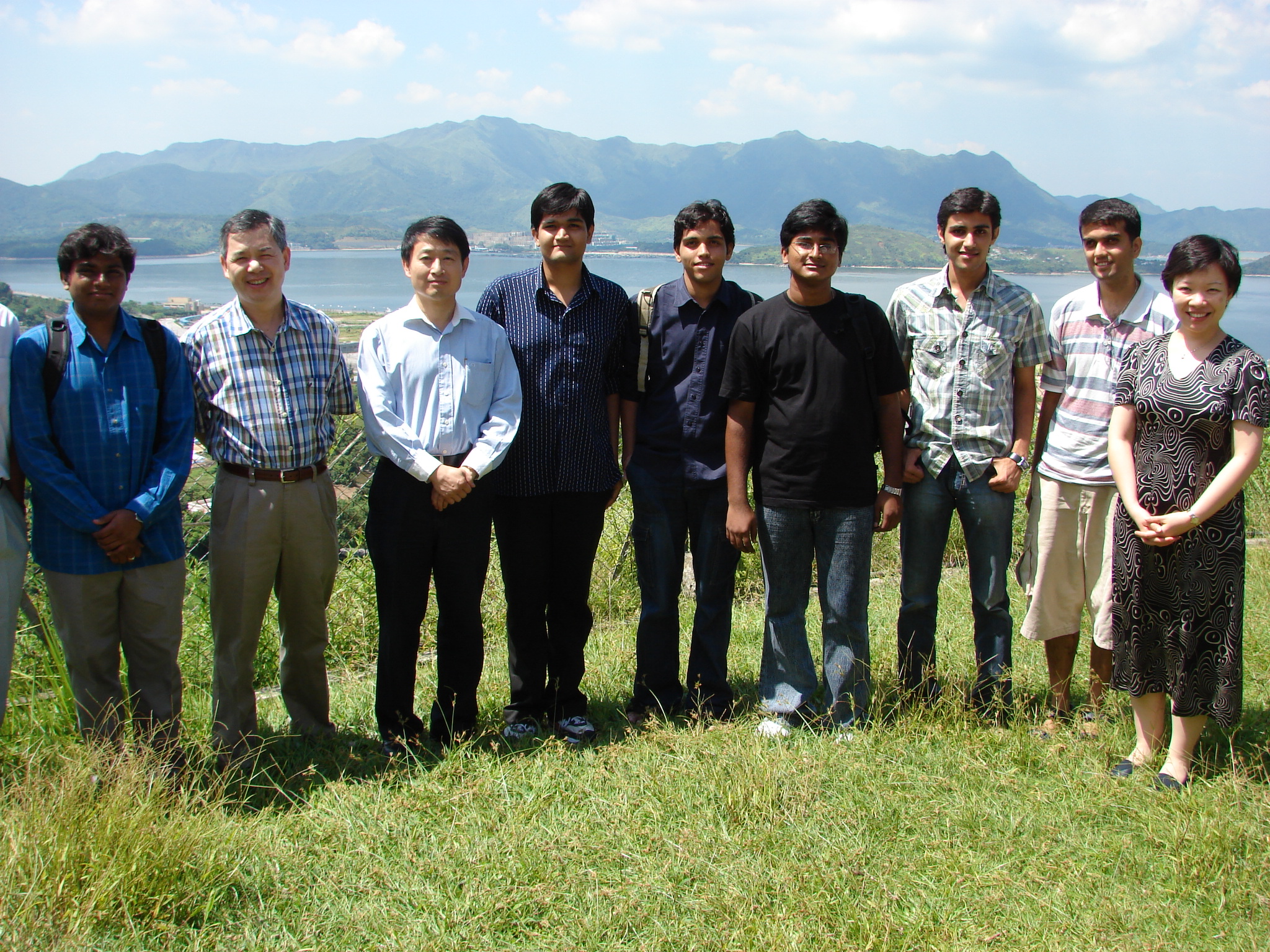 Interns and their three supervisors, Professor YAM Yeung, Chairman of Department of Mechanical and Automation Engineering (2nd from left), Professor Sidharth JAGGI, Department of Information Engineering (2nd from right), Professor Meng Mei-Ling, Department of System Engineering and Engineering Management (1st from right), together with Professor YUM Tak Shing, Dean of the Faculty of Engineering (3rd from left).