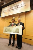 CUHK Vice-Chancellor Professor Lawrence J. Lau presents a souvenir to Mr. Takanori Kitamura