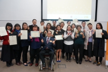 A group photo of guests and graduates.