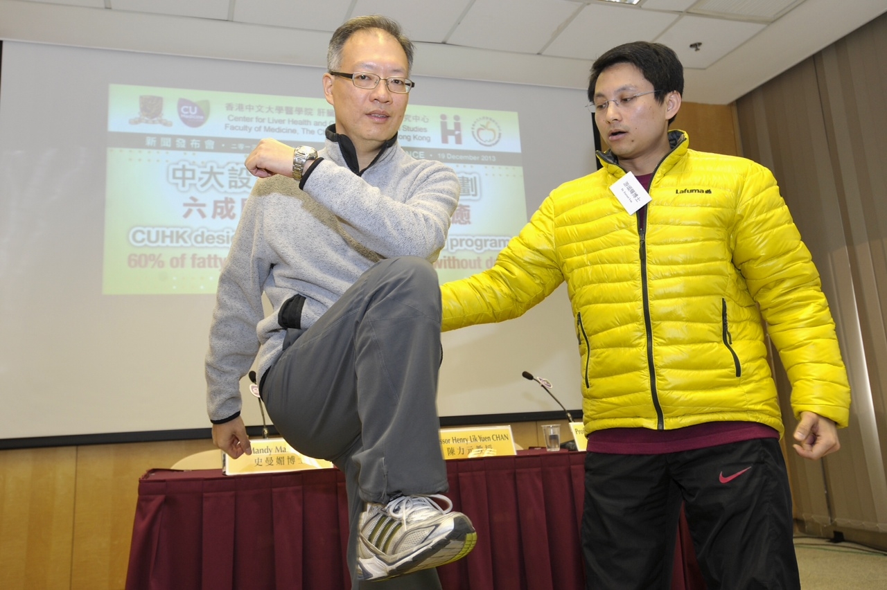 Dr. Chung Fai YAU (right) and Mr. SUM, a fatty liver patient, demonstrate exercise of the Lifestyle Modification Program.