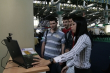 CINTEC staff showing interactive multi-media video to visitors