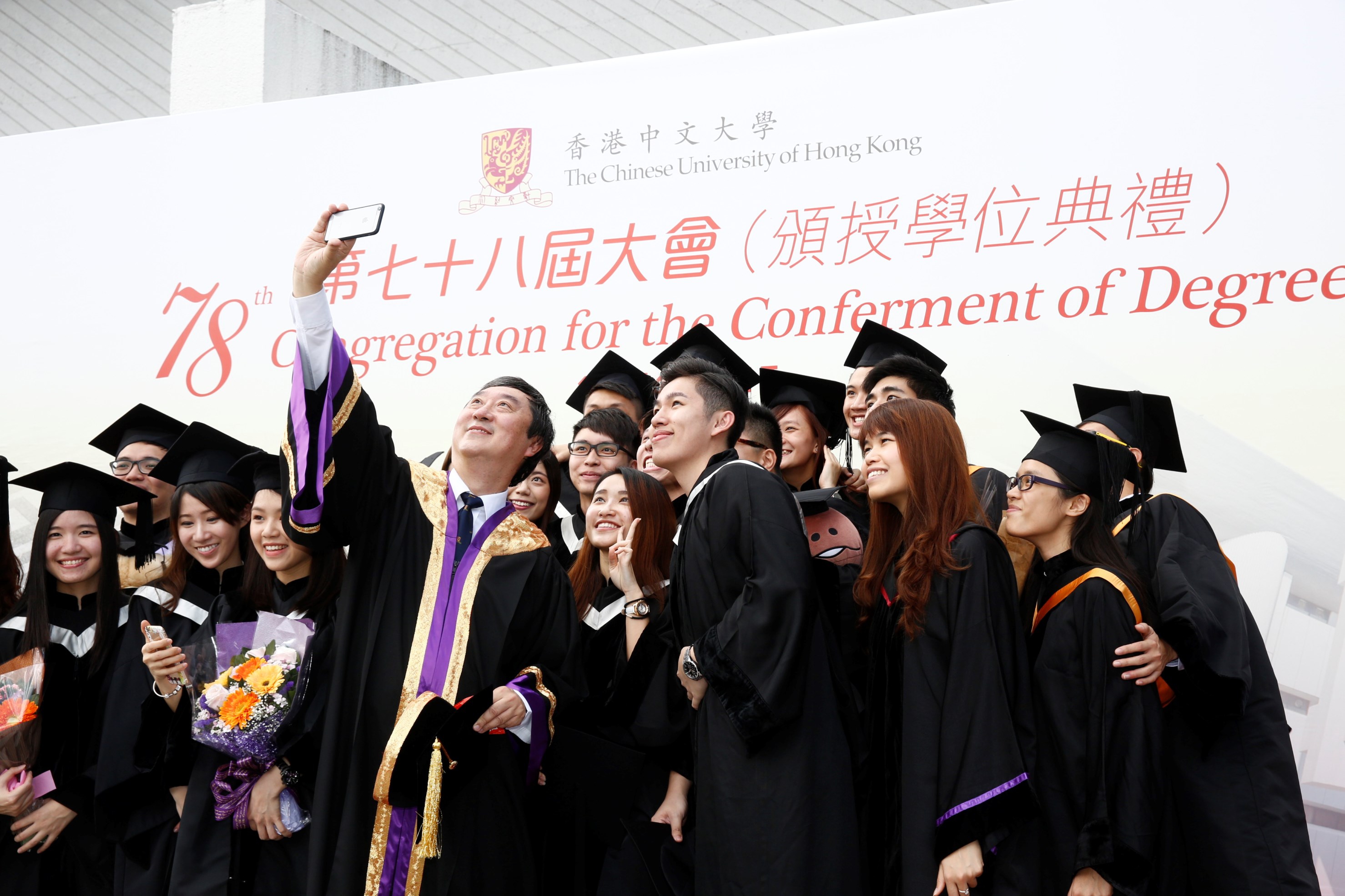 Prof. Joseph Sung shares the joyful moment with graduates.