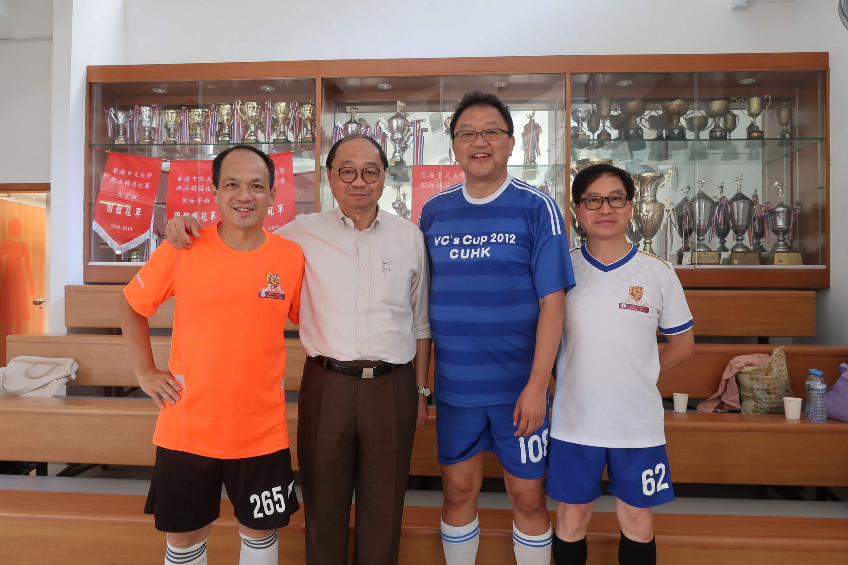 (From left) Mr. Ho Yuk-wing, Professor Henry Wong, Professor Wong Kam-fai and Mr. Chan Shu-pui from the CUHK staff football club receive the 2018 Long Service Awards together.