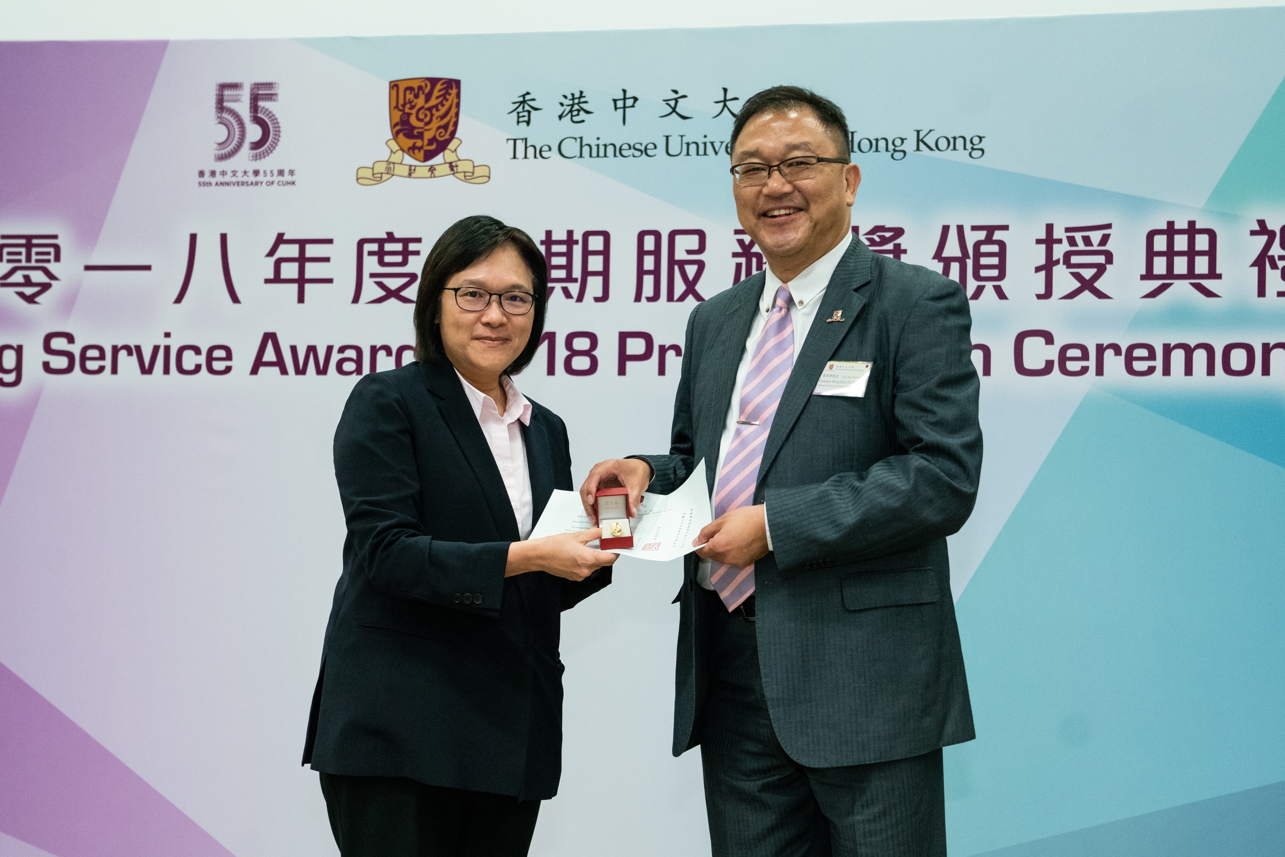 Professor Wong Kam-fai receives the 25-year long service award.