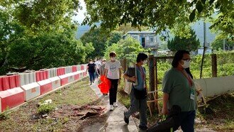    The outreach team organised by CU Medicine revisits the remote villages in Lantau Island to give vaccinations for the children, the elderly and residents of less mobility.