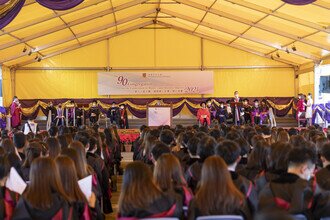 The University Mall being full to capacity with joyful graduates, their families and friends, and the Faculty members