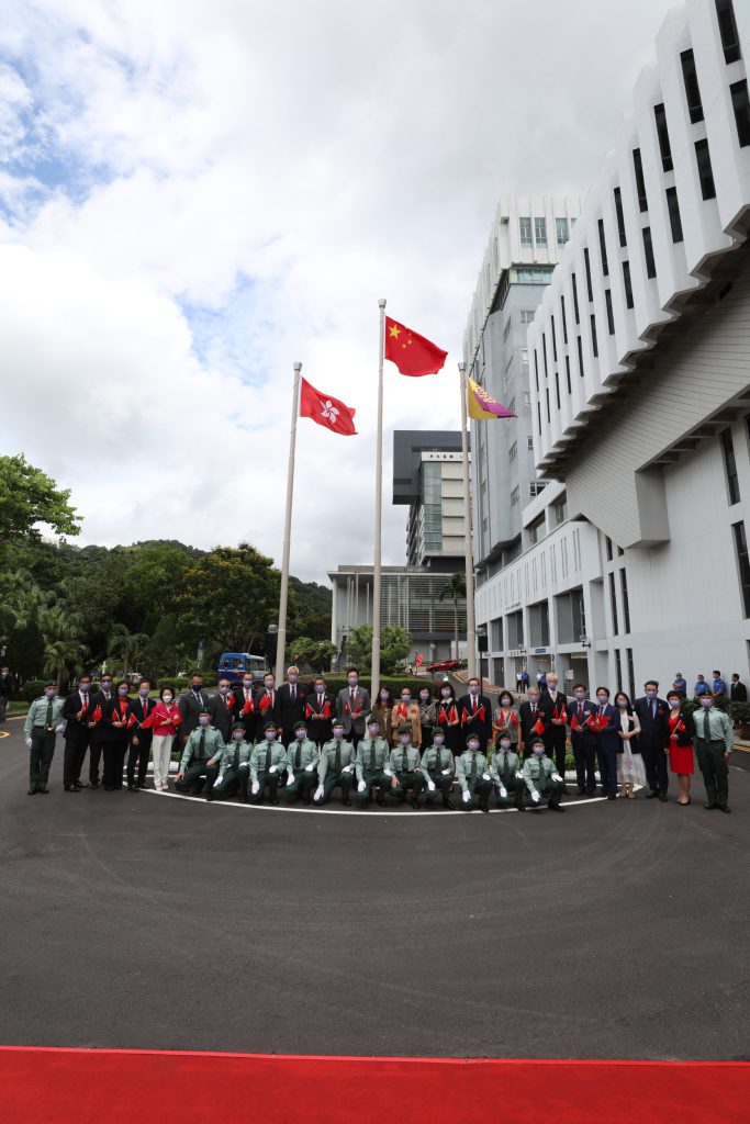 A group photo of University officers and the flag-raising team.