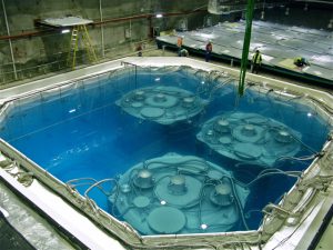 Inside the Far Experimental Hall in the Daya Bay Reactor Neutrino Experiment. Four anti-neutrino detectors are installed in the water pool (three of them are shown in this photo).