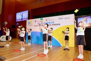 Photo shows ten students from the Yaumati Catholic Primary School (Hoi Wang Road) demonstrating an online physical activity class with coach using Zoom.