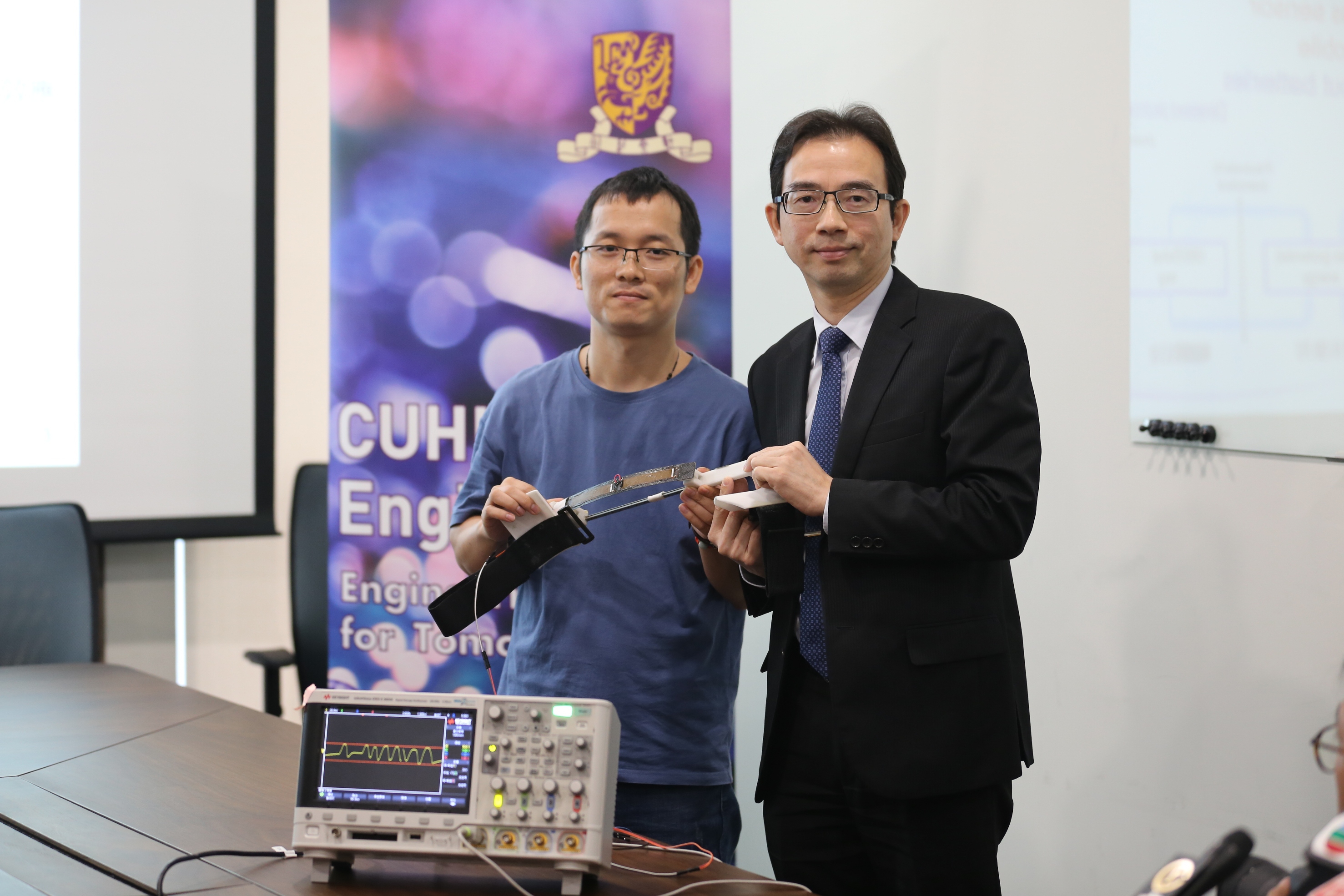 Professor Liao (right) and his Postdoctoral fellow Gao Fei (left) develop this energy harvester device in six months’ time.