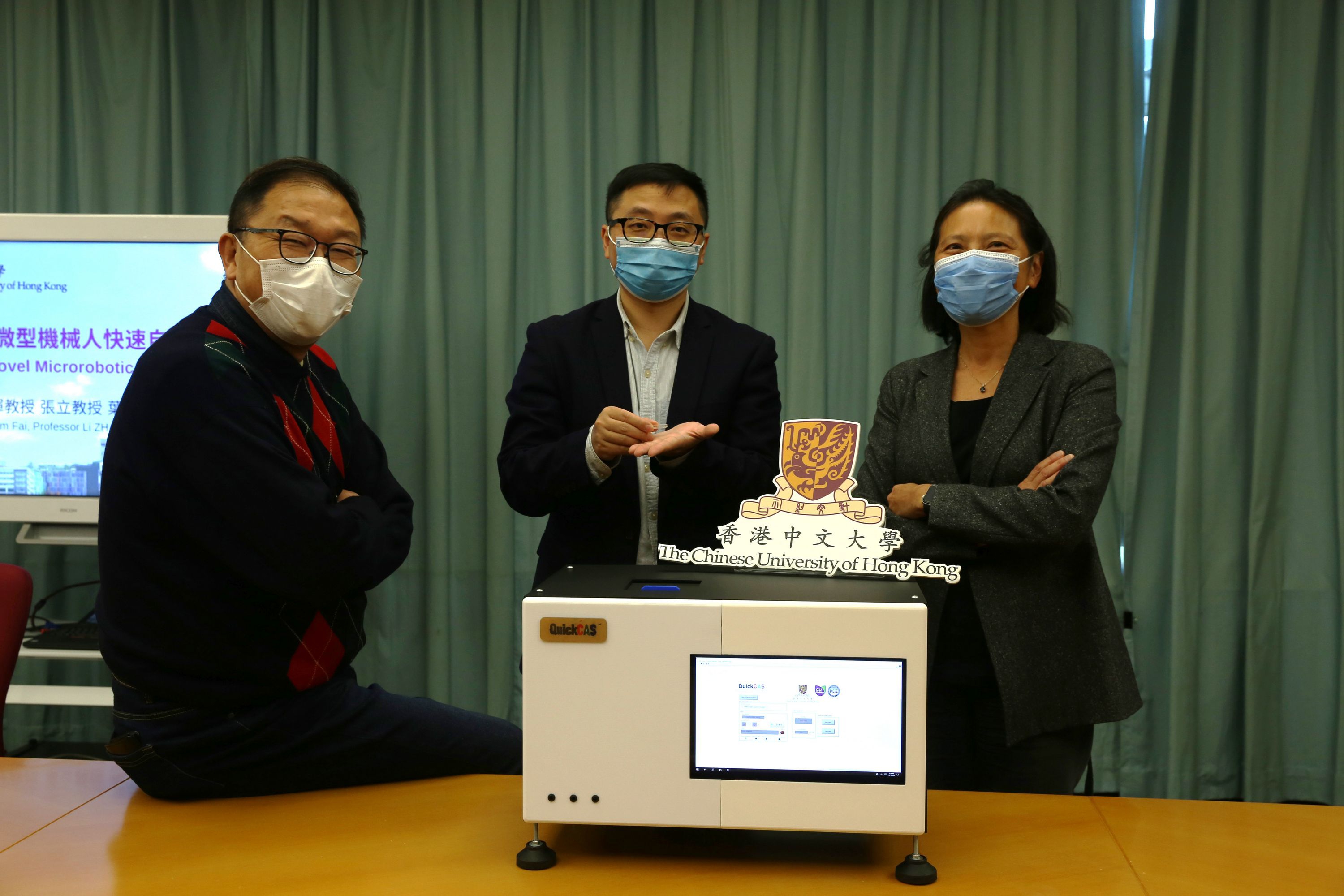 CUHK has recently developed a fully automated, low cost and rapid microrobotic diagnostic system with comparable sensitivity and specificity to clinical detection methods. The research team is now entering clinical trials, with the goal of testing in hospitals next year.
From left: Prof. Kam Fai WONG, Professor, Department of Systems Engineering & Engineering Management; Professor Li ZHANG, Associate Professor, Department of Mechanical and Automation Engineering; Professor Margaret IP, Professor, Department of Microbiology.