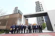 The guests at the front gate of CUHK Jockey Club Postgraduate Halls 2 & 3.