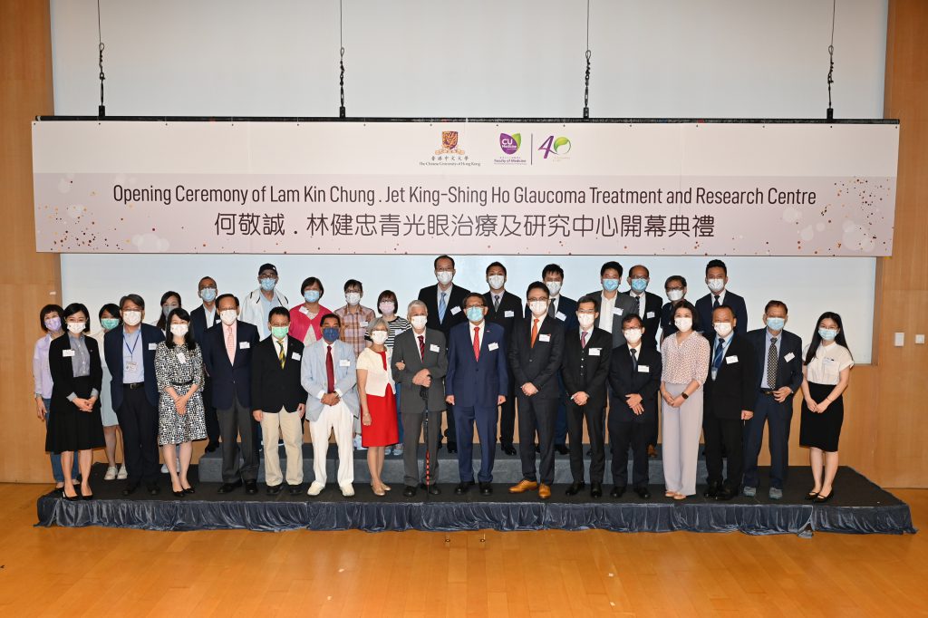 The CUHK OVS team takes a group photo with guests and counterparts.