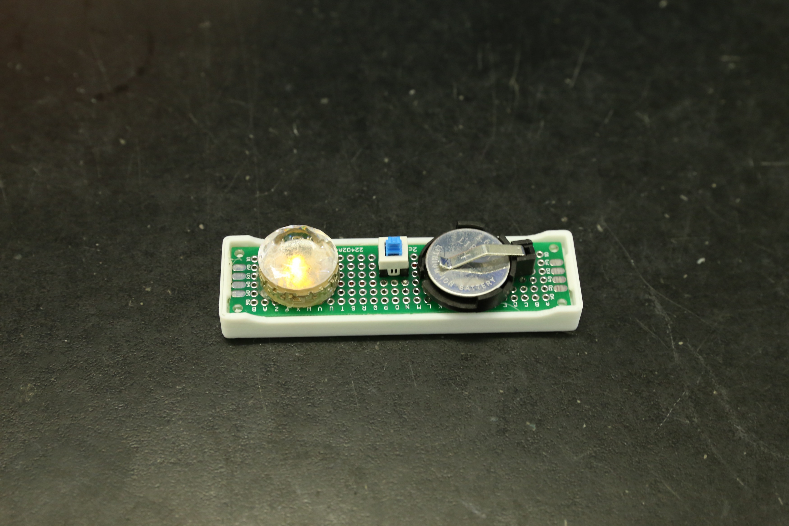 LED light powered by a molecular crowding battery prototype.