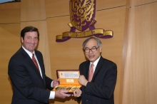 CUHK Vice-Chancellor Prof Lawrence J Lau presents a souvenir to the Lt Governor.