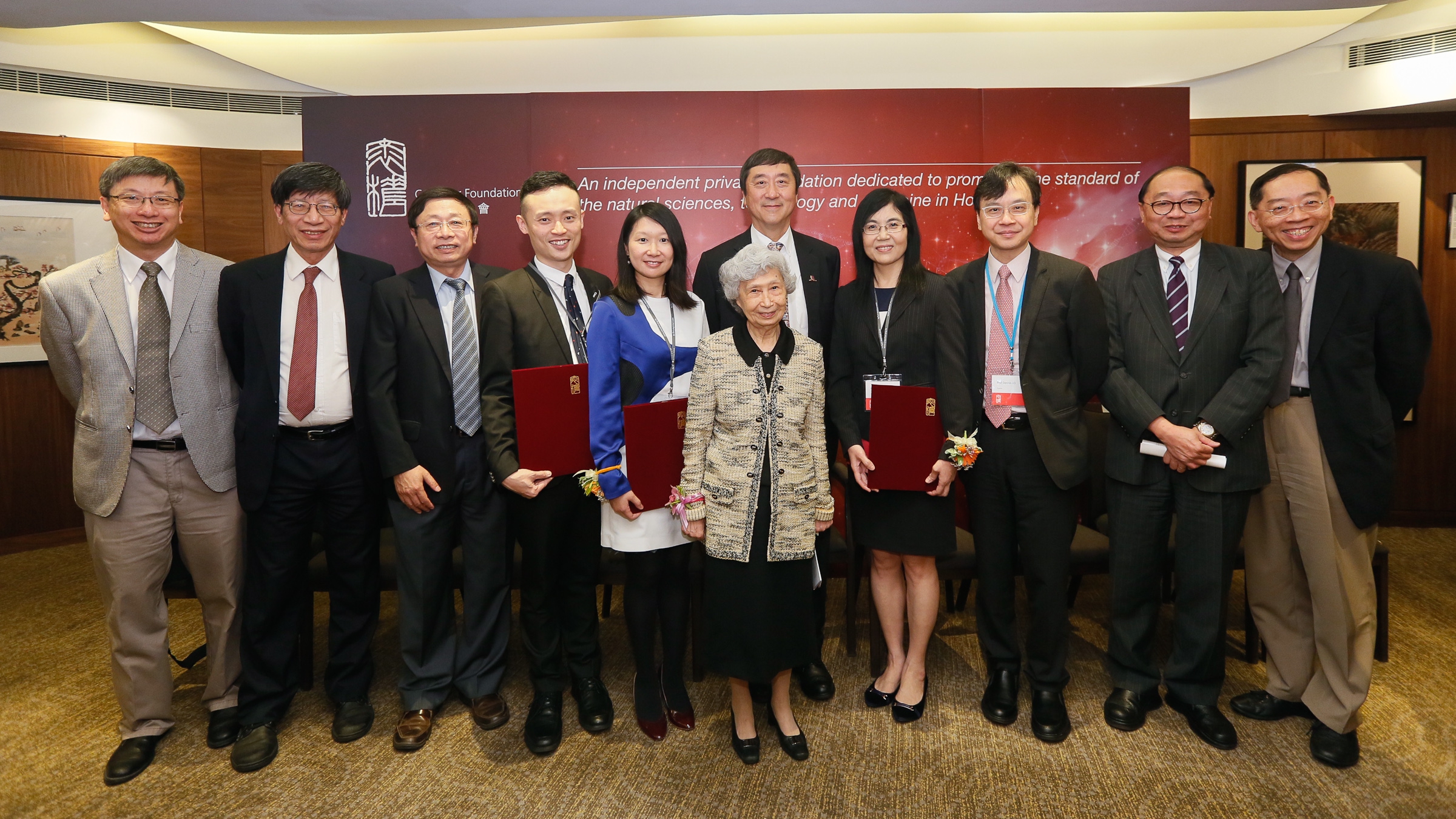 Prof. Rosie YOUNG (front row) poses for a group photo with CUHK members. (From left, back row) Prof. TSANG Hon-ki, Chairman of the Department of Electronic Engineering; Prof. Kenneth YOUNG, Master of C.W. Chu College; Prof. HUANG Yu, Professor of the School of Biomedical Sciences; Prof. Jonathan CHOI, recipient of Croucher Innovation Award 2016; Prof. Rossa CHIU, recipient of Croucher Senior Medical Research Fellowship 2016; Prof. Joseph SUNG, Vice-Chancellor and President of CUHK; Prof. Jun YU, recipient of Croucher Senior Research Fellowship 2016; Prof. Dennis LO, Associate Dean (Research) of the Faculty of Medicine; Prof. Henry WONG, Dean of the Faculty of Science; and Prof. Arthur MAK, Professor, Department of Mechanical and Automation Engineering.