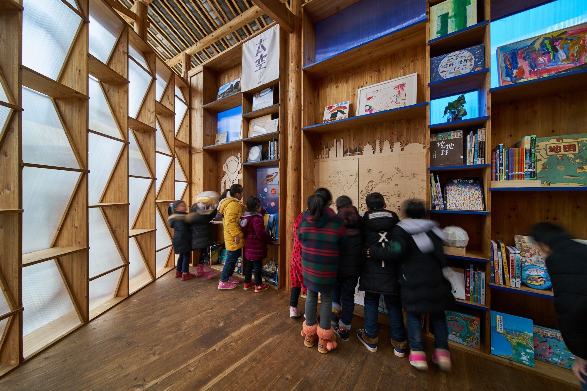 The exterior walls of the Book House are made up of book shelves and translucent plastic sheets.