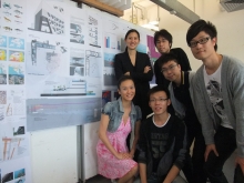 Prof. Marisa Yiu (left, back row) and master students pose in front of their project 'New Market and Waterfront Communities' in Aberdeen