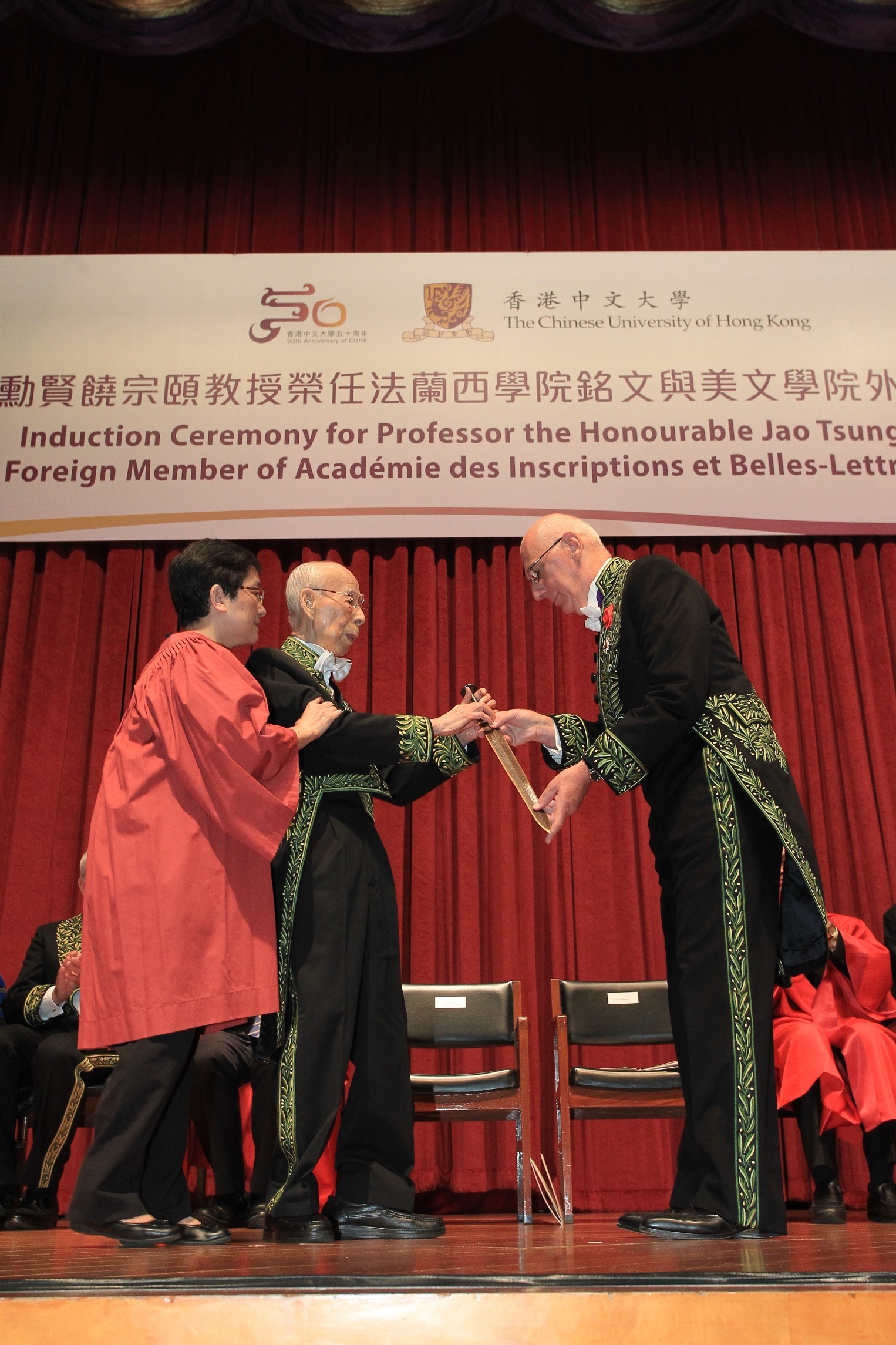 Prof. Michel Zink, Permanent Secretary, Académie des Inscriptions et Belles-Lettres of Institut de France (right) presents the Sword of Goujian to Prof. Jao Tsung-I.