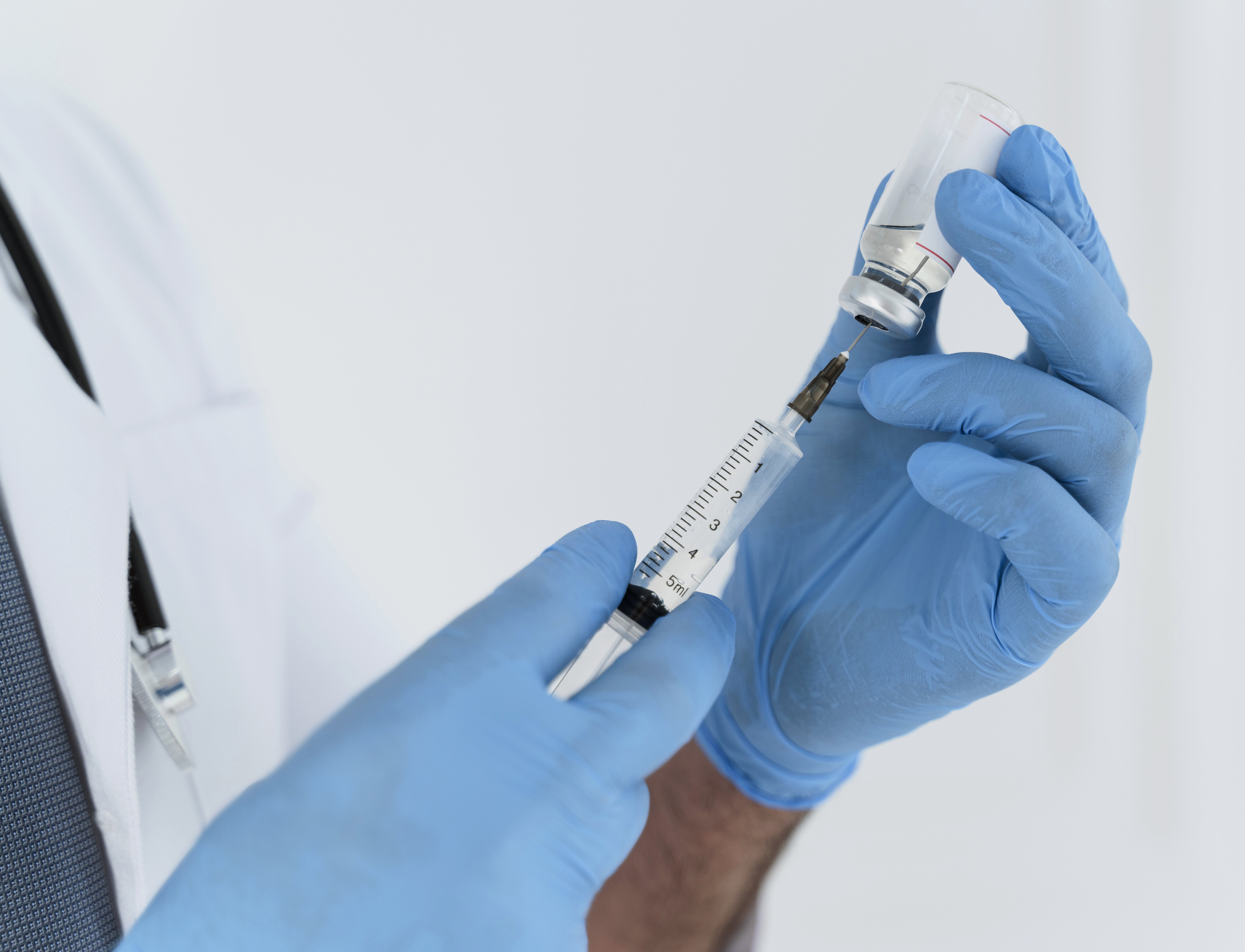 doctor-holding-syringe-close-up