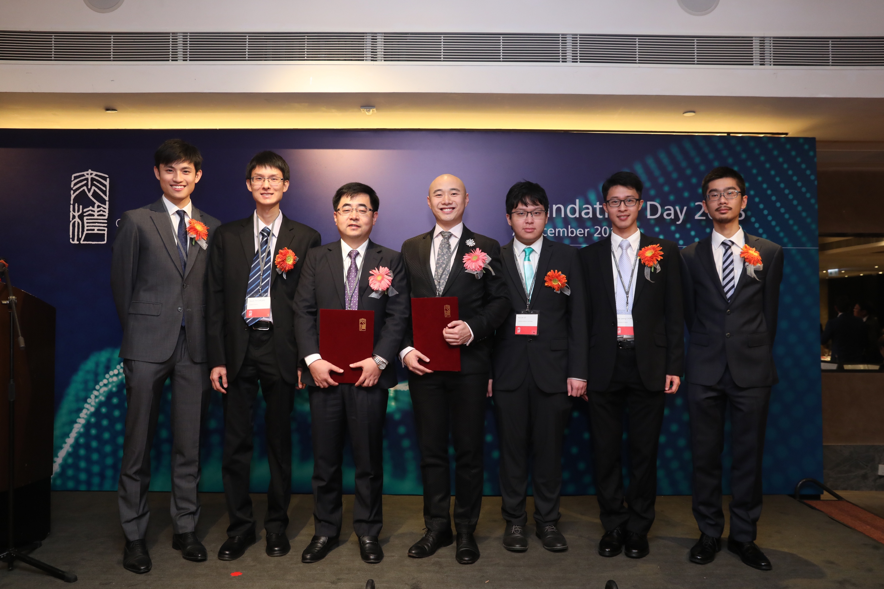 A group photo of CUHK professors and alumni receiving awards from The Croucher Foundation. (From left) Dr. Andrew John Kwok, Dr. Kwan Yin Cheung, Prof. Qian Miao, Prof. Tjonnie Li, Mr. Rico Ka Lok Lo, Dr. Steven Kai Leong Chong and Mr. Chi Cheuk Tsang.