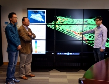 Prof. Lin Hui, the director of ISEIS, (2nd left), discusses the monitoring of the deformation of the reclaimed Hong Kong International Airport with his teammates.