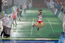 Mr Hanniel Chow crosses the finish line at a Marathon