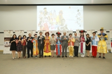 Guests attending the opening ceremony take a group photo with the students.