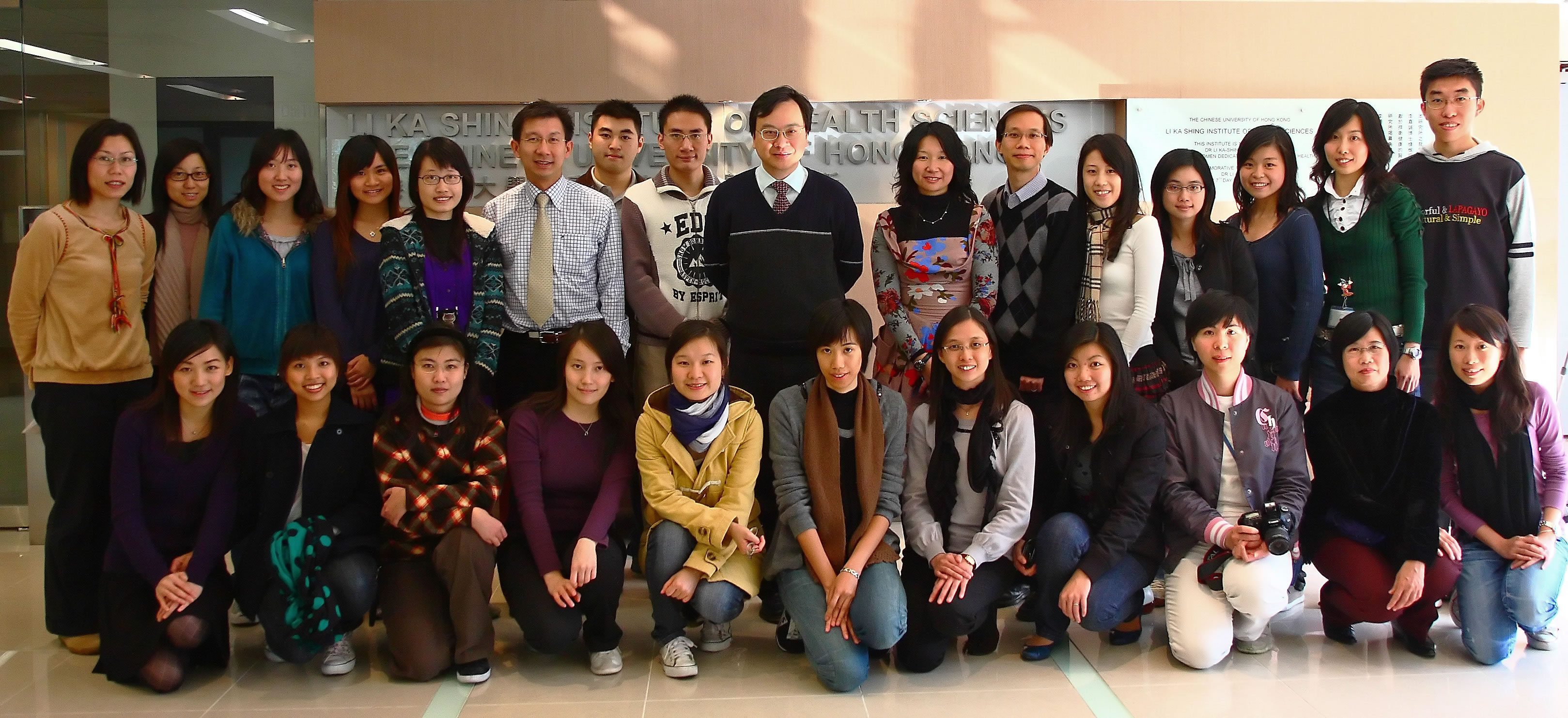 Prof. Dennis Y.M. Lo (centre, back row) with his team of young researchers