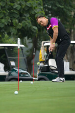 Golfers practising on Putting Green