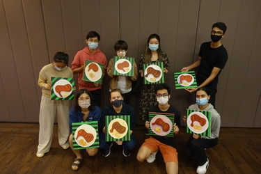 Students with their paintings