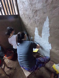 Students painting walls