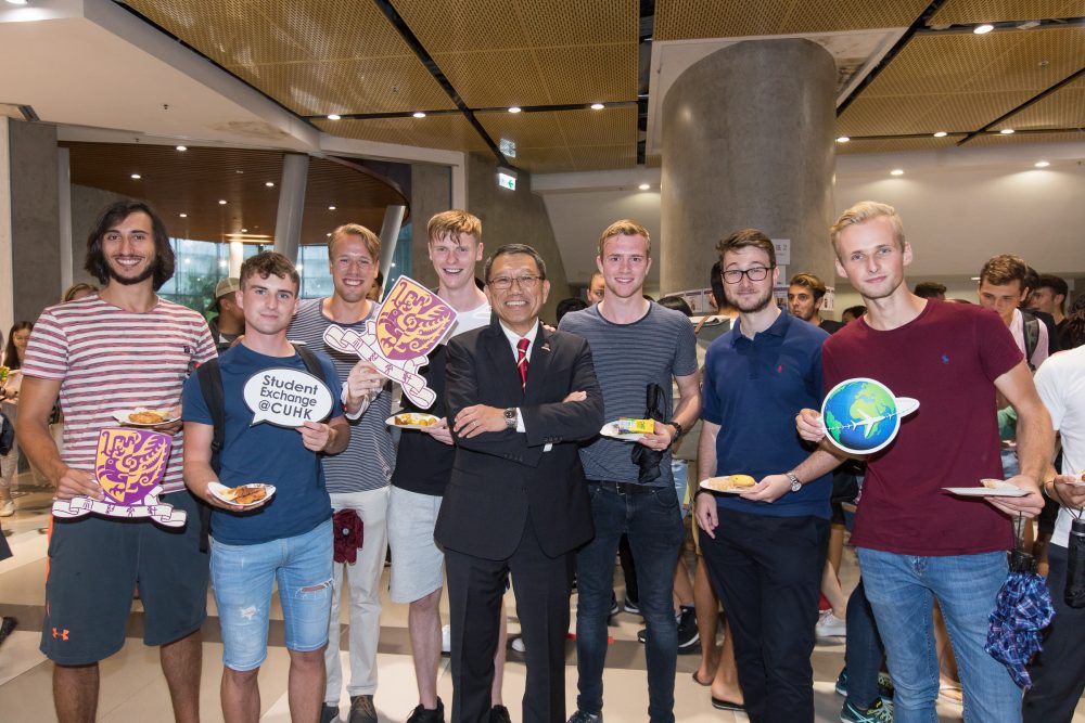 Students enjoy some traditional local snacks with the Vice-Chancellor.