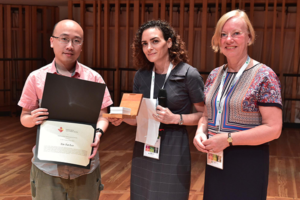 Yin Tat Lee onstage holding his award certification, with Simge Kucukyavuz and Karen Aardal