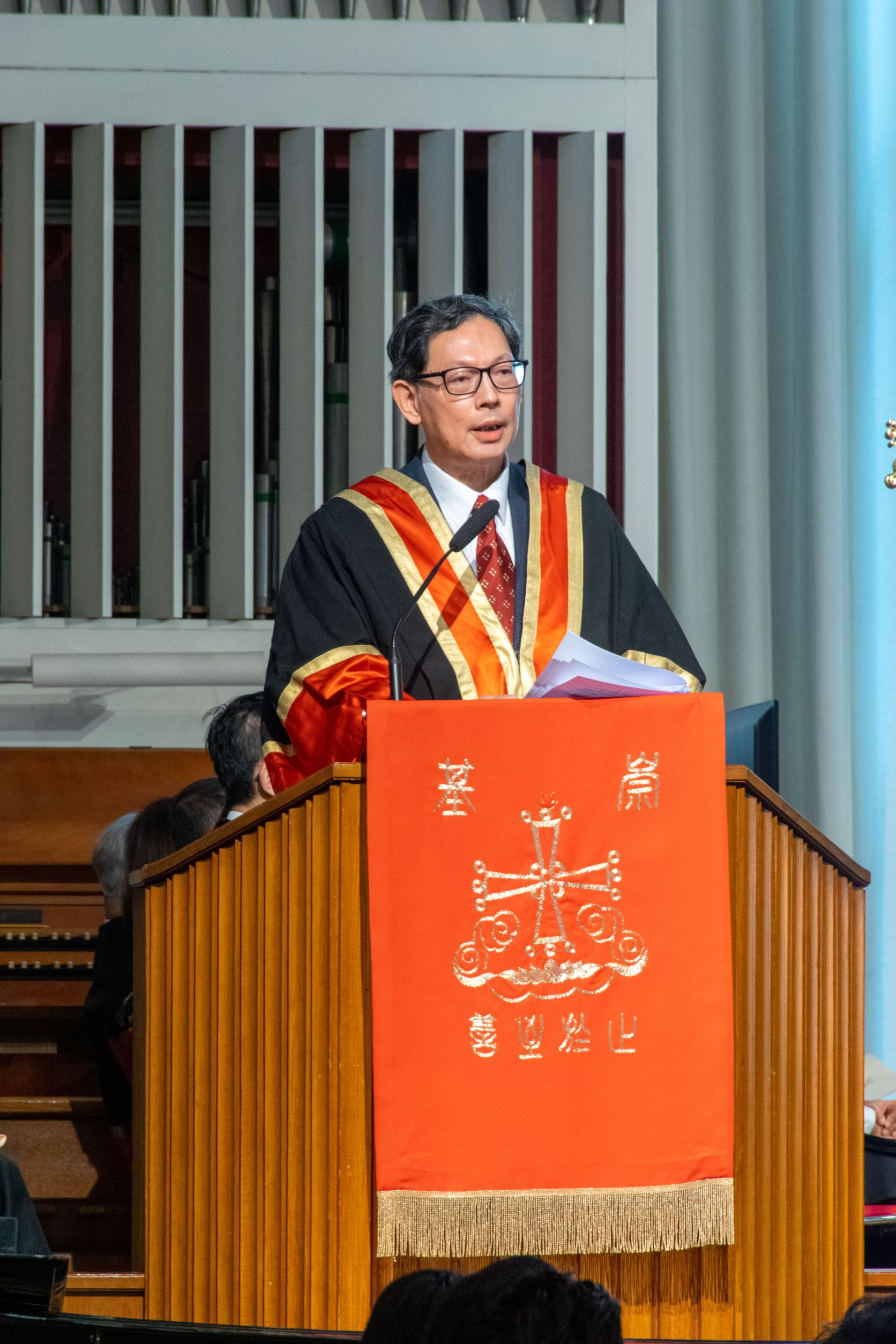 Dr. Norman Chan Tak-lam giving speech at Thanksgiving Service.