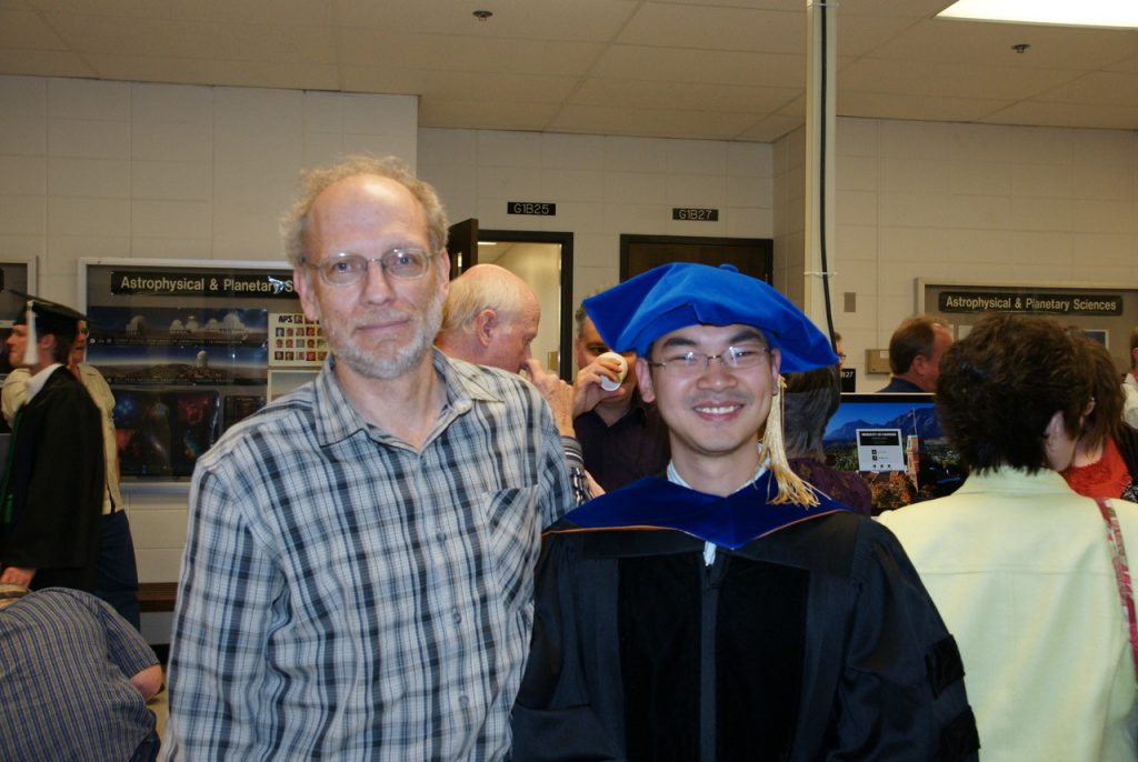 A group photo of Professor Lin LIU (right) and the late Professor John WAHR (left) at the graduation ceremony for doctoral degree at the University of Colorado Boulder in 2011.