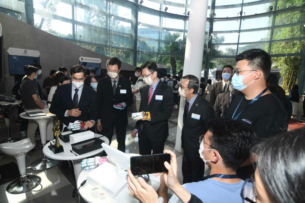 Professor Sun Dong, Hong Kong government’s Secretary for Innovation, Technology and Industry, tours the exhibition booths at the CUHK Innovation Day.